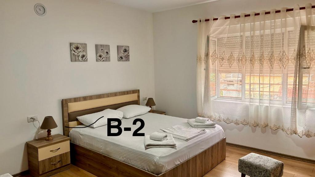 Postel nebo postele na pokoji v ubytování Dritëza