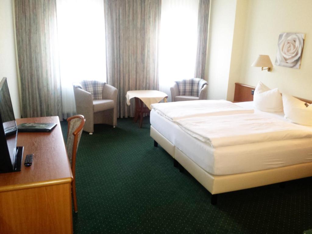 Postel nebo postele na pokoji v ubytování Hotel Evabrunnen