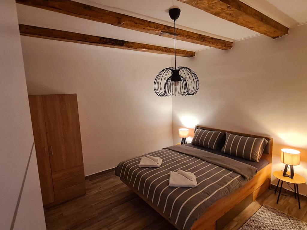 Postel nebo postele na pokoji v ubytování Apartman Denis