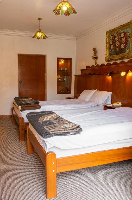 Voodi või voodid majutusasutuse Hotel La Posada de Atahualpa toas