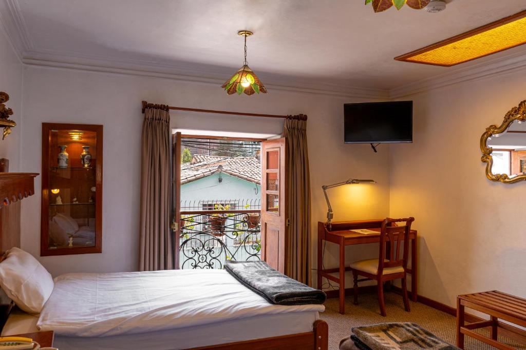 Voodi või voodid majutusasutuse Hotel La Posada de Atahualpa toas