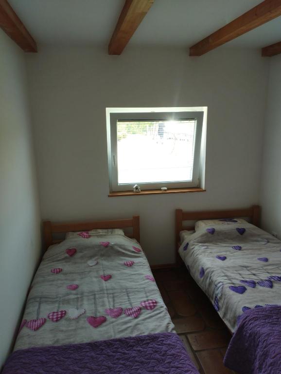 Postel nebo postele na pokoji v ubytování Etno selo EKO POGLEDI