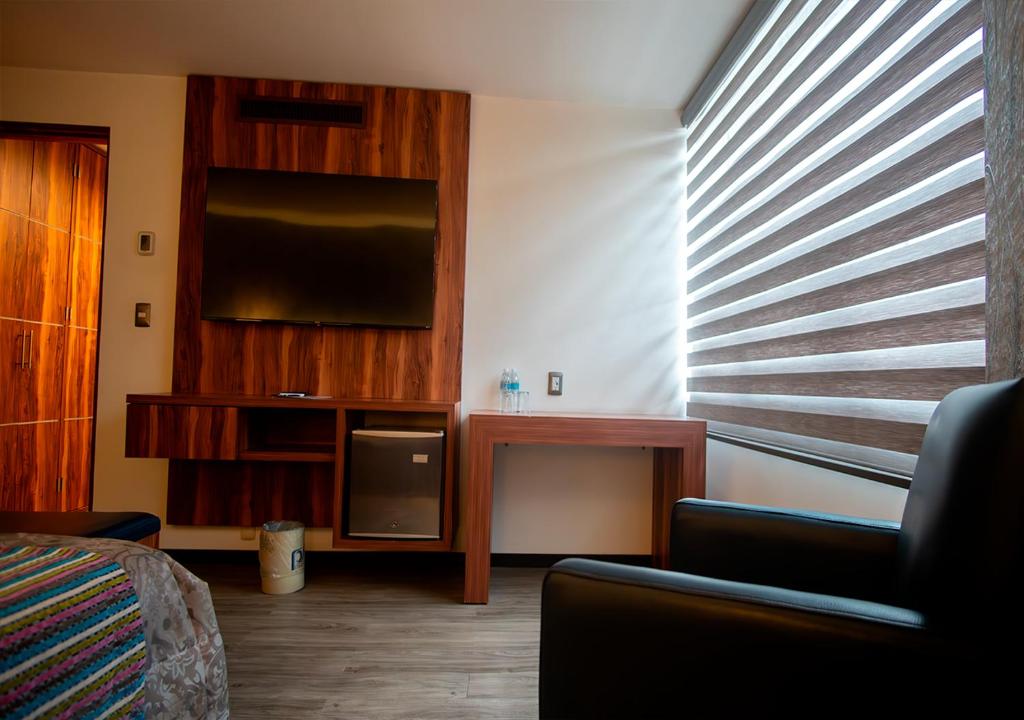 Postel nebo postele na pokoji v ubytování Hotel Parque Satelite