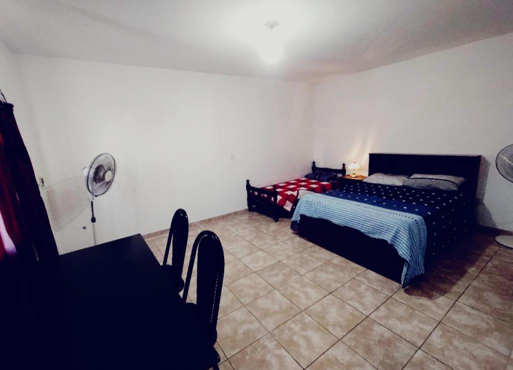 En eller flere senge i et værelse på DEPTOSVM Complejo