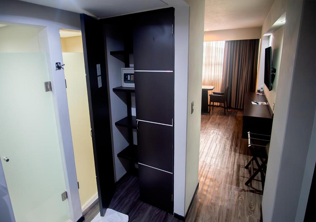 Postel nebo postele na pokoji v ubytování Hotel Parque Satelite