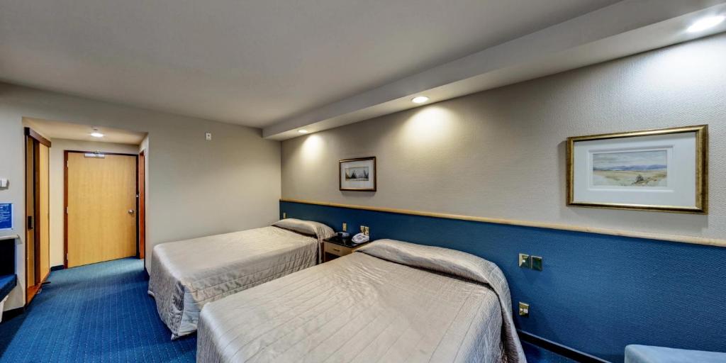 Postel nebo postele na pokoji v ubytování Distinction Luxmore Hotel
