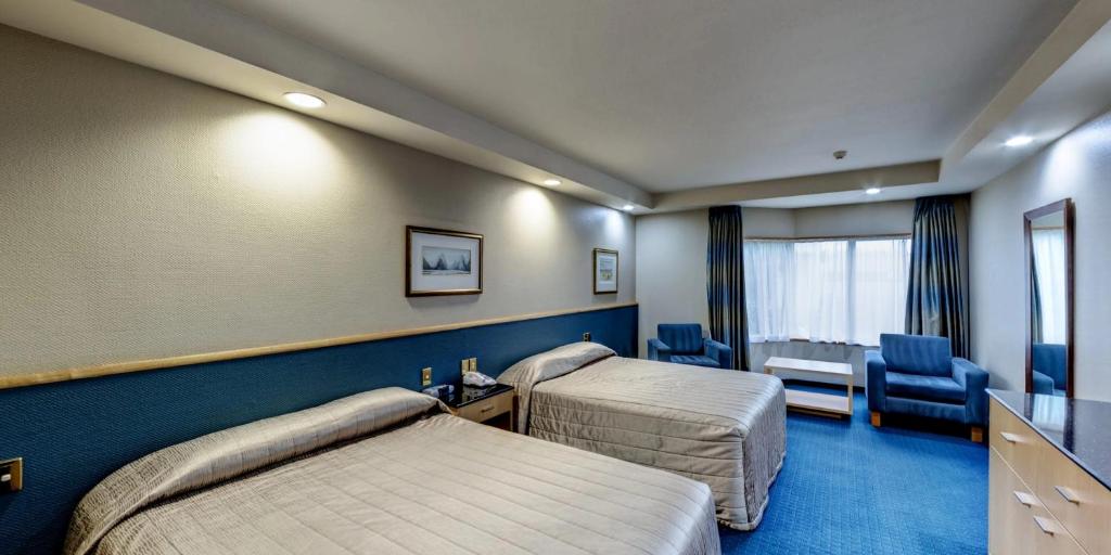 Postel nebo postele na pokoji v ubytování Distinction Luxmore Hotel
