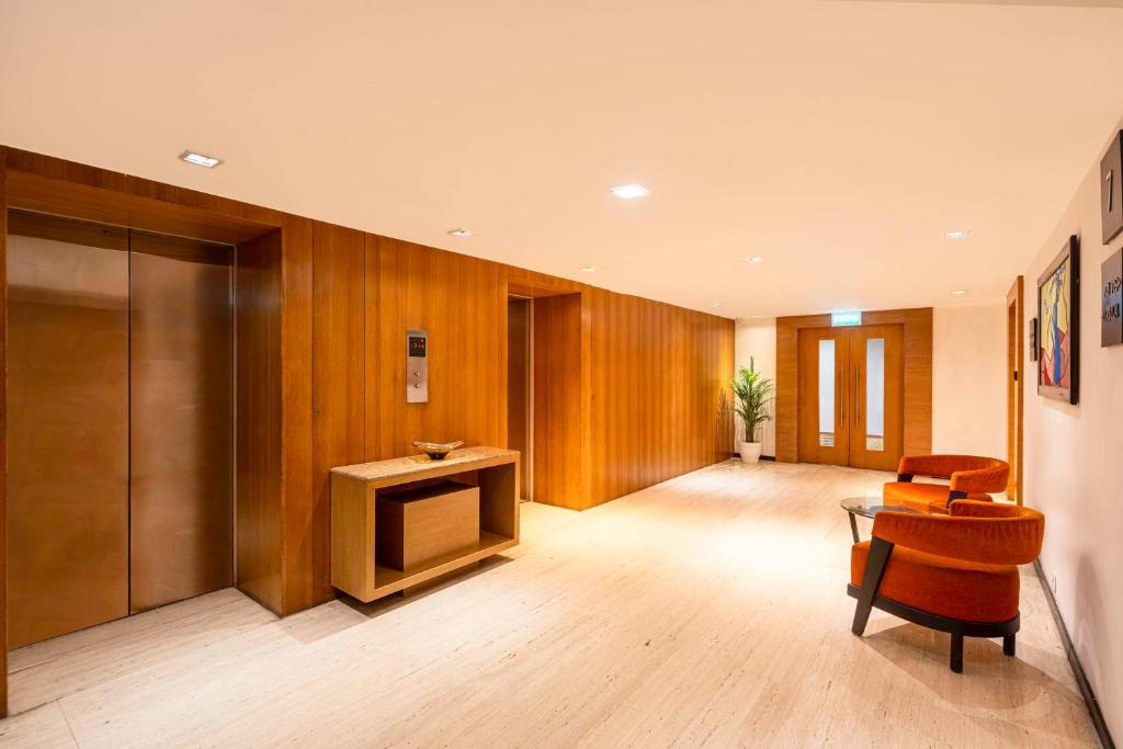 a living room with a table and a television at Svelte Delhi, a member of Radisson Individuals in New Delhi