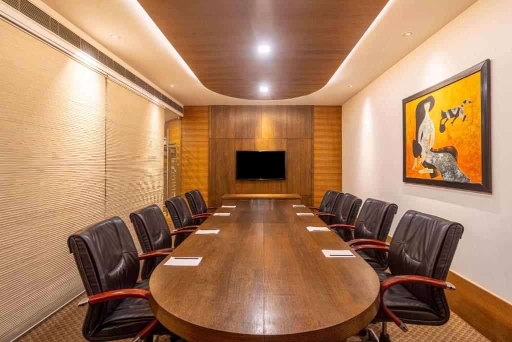 a conference room with a long table and chairs at Svelte Delhi, a member of Radisson Individuals in New Delhi