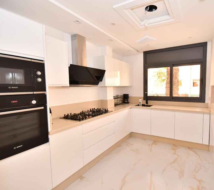 Kuchyň nebo kuchyňský kout v ubytování Appartement Dalisa