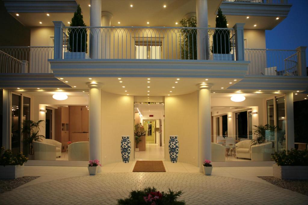 a front view of a house at night at Hotel Gala in Riccione