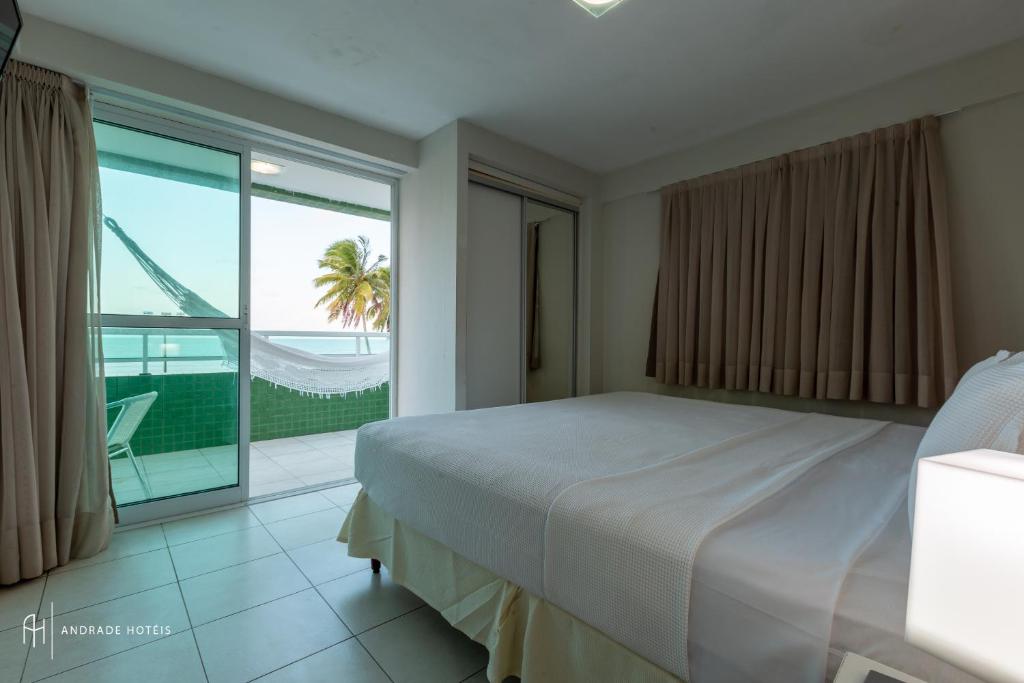Cama ou camas em um quarto em Rede Andrade Solmar