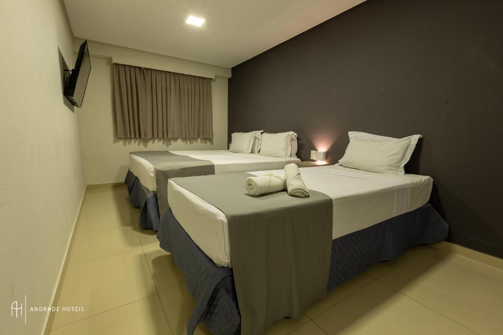 Cama ou camas em um quarto em Rede Andrade Solmar