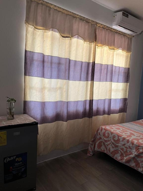 Postel nebo postele na pokoji v ubytování Casa Alexita