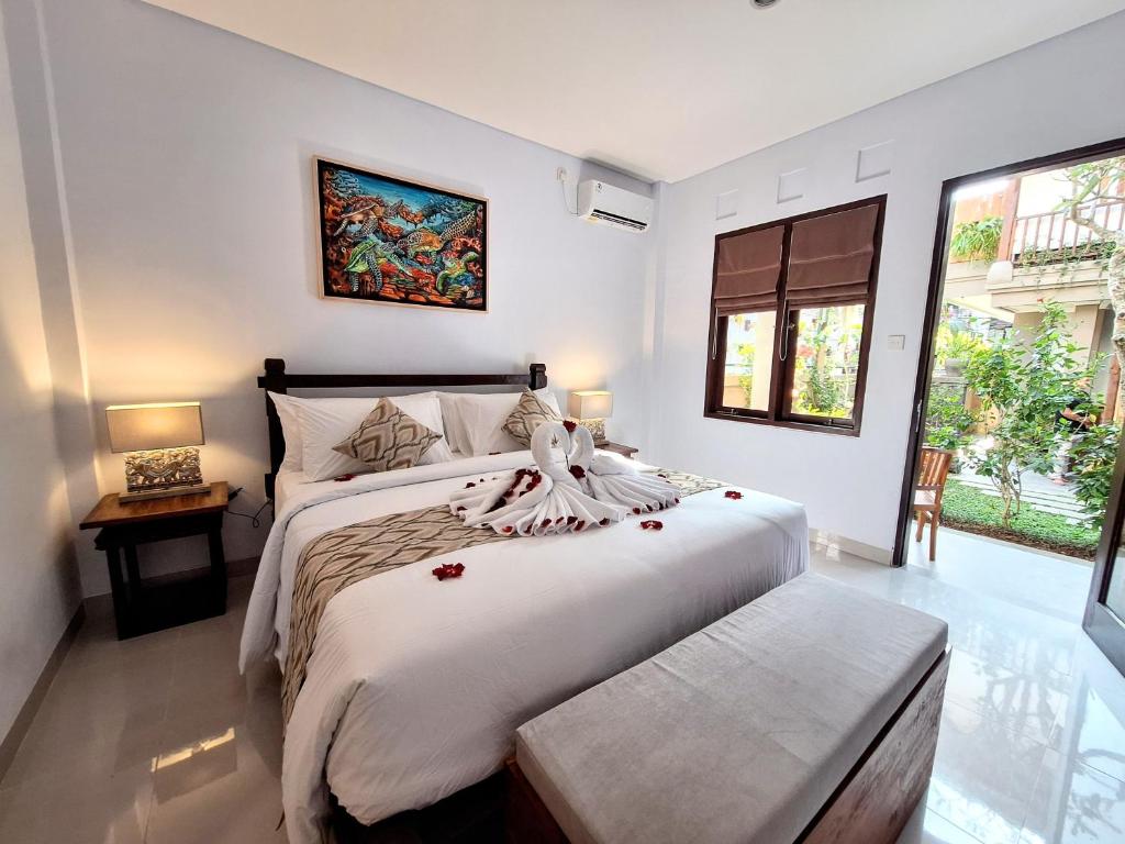 Postel nebo postele na pokoji v ubytování Ubud Gata Guest House