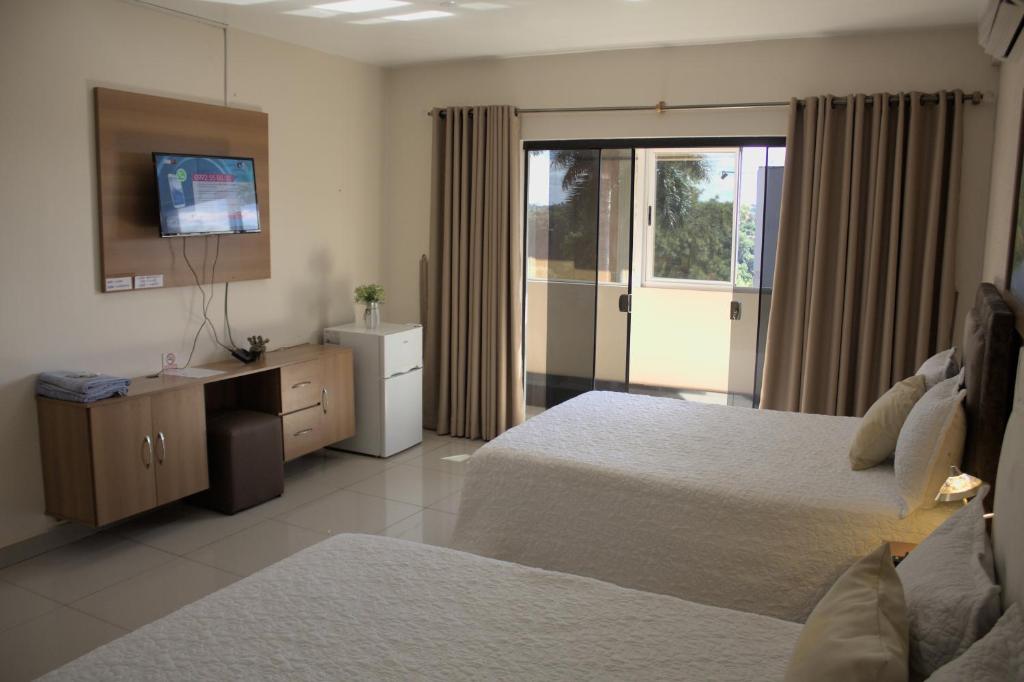 Postel nebo postele na pokoji v ubytování Darling Hotel Ciudad del Este