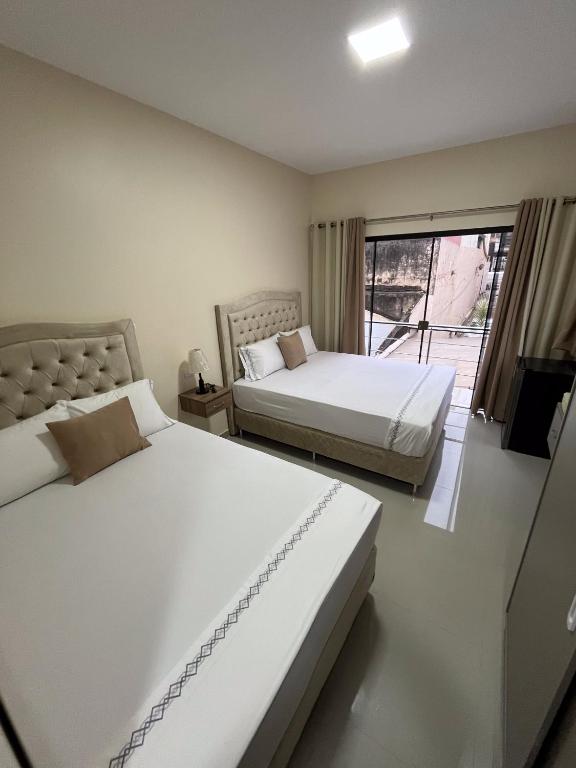 Postel nebo postele na pokoji v ubytování Darling Hotel Ciudad del Este