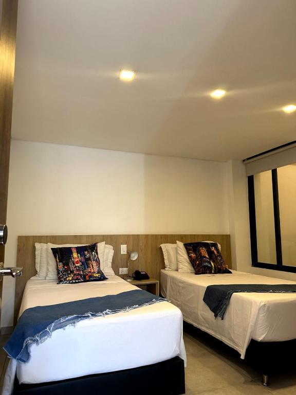 Postel nebo postele na pokoji v ubytování Hotel Zona Verde