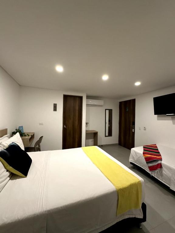 Postel nebo postele na pokoji v ubytování Hotel Zona Verde