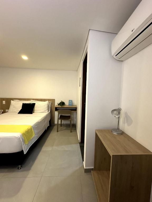 Postel nebo postele na pokoji v ubytování Hotel Zona Verde
