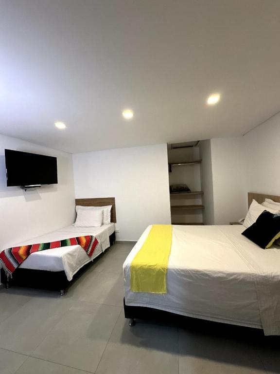 Postel nebo postele na pokoji v ubytování Hotel Zona Verde
