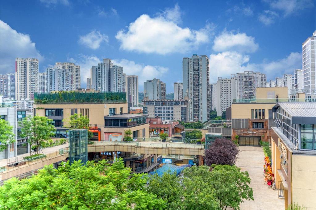 a view of a city with tall buildings at Wuyu Hotel - Chongqing Jiangbei Airport & Light Rail in Chongqing