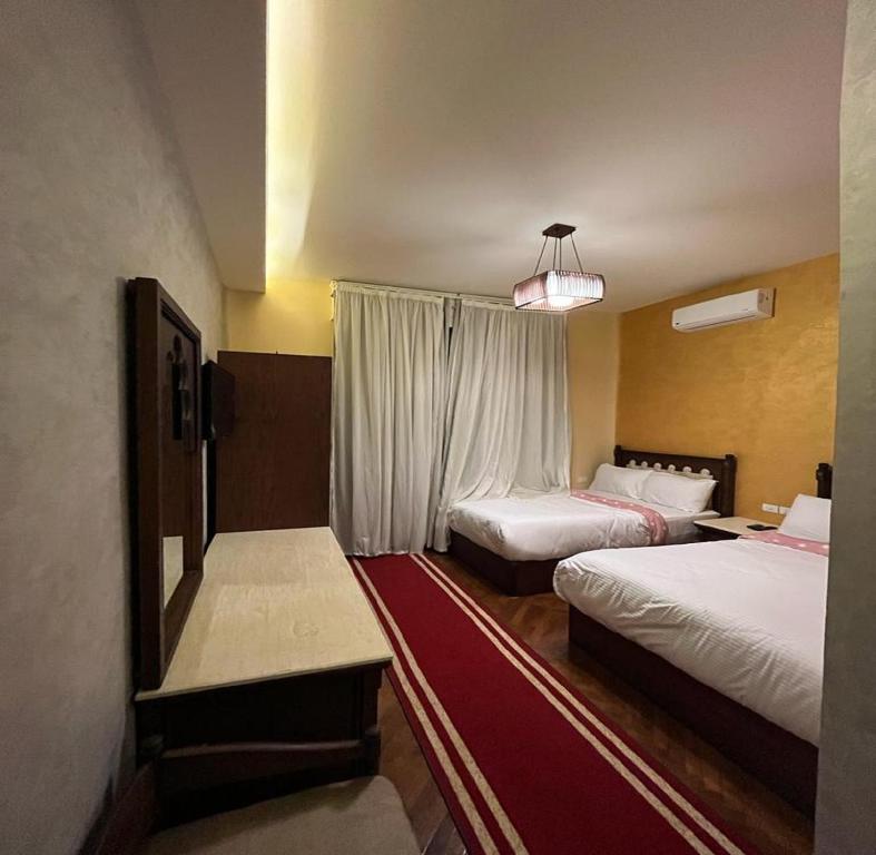 Postel nebo postele na pokoji v ubytování Cairo Dream Boutique Hotel