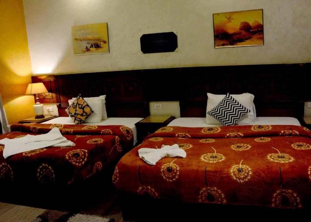 Postel nebo postele na pokoji v ubytování Cairo Dream Boutique Hotel