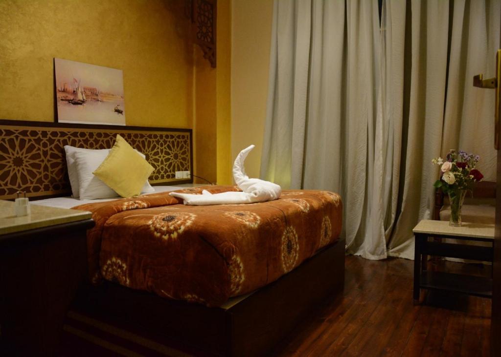 Postel nebo postele na pokoji v ubytování Cairo Dream Boutique Hotel