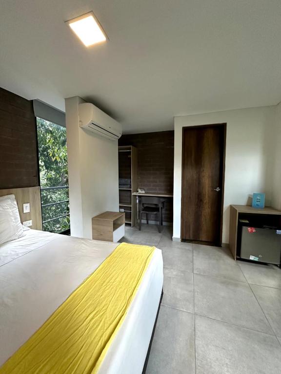 Postel nebo postele na pokoji v ubytování Hotel Zona Verde
