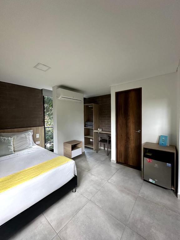 Postel nebo postele na pokoji v ubytování Hotel Zona Verde