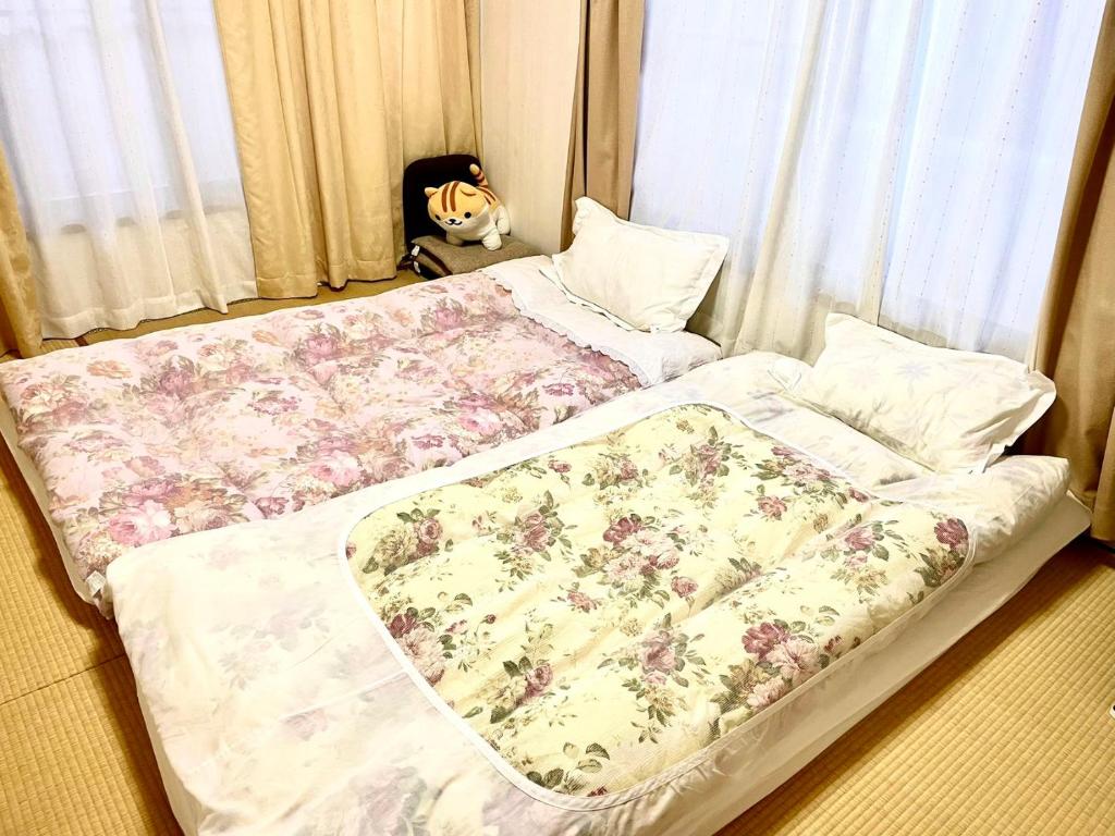 Postel nebo postele na pokoji v ubytování 帝京大学付近 十条
