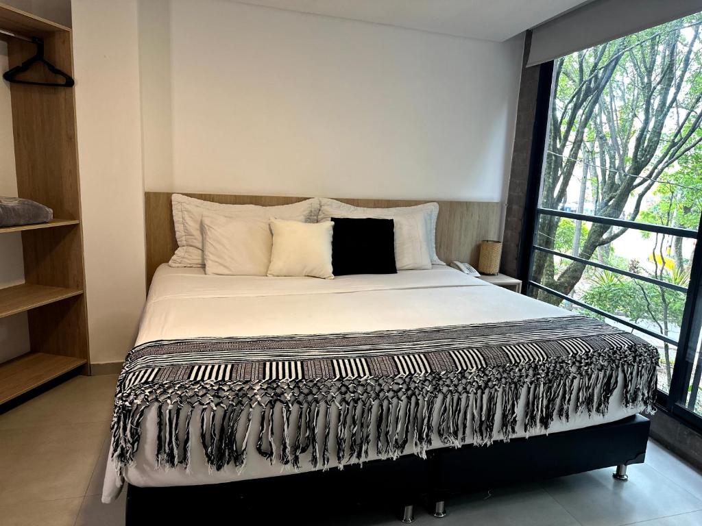 Postel nebo postele na pokoji v ubytování Hotel Zona Verde