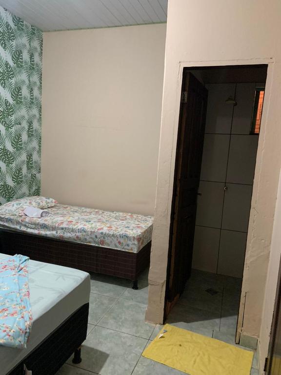 Postel nebo postele na pokoji v ubytování KitNet com cozinha e ar