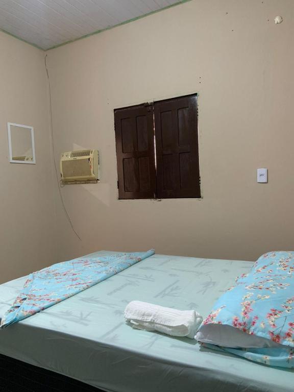 Postel nebo postele na pokoji v ubytování KitNet com cozinha e ar