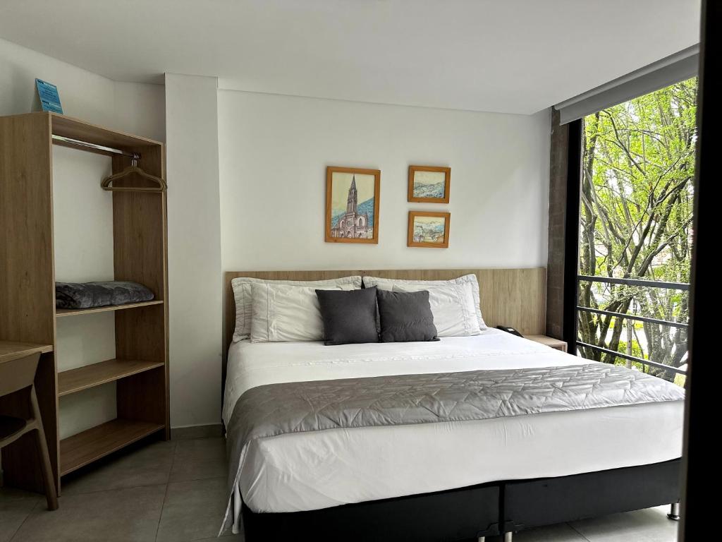 Postel nebo postele na pokoji v ubytování Hotel Zona Verde