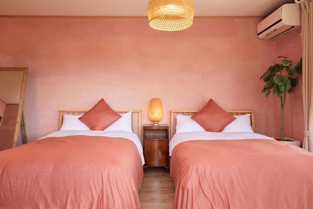 Postel nebo postele na pokoji v ubytování 一棟貸し別荘 mitt house inn