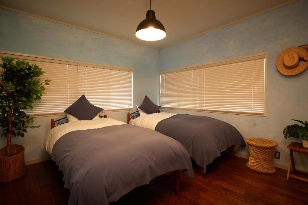 Postel nebo postele na pokoji v ubytování 一棟貸し別荘 mitt house inn