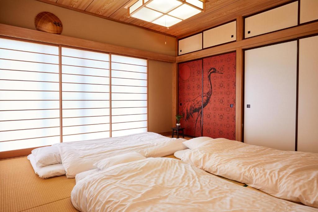 Postel nebo postele na pokoji v ubytování 一棟貸し別荘 mitt house inn