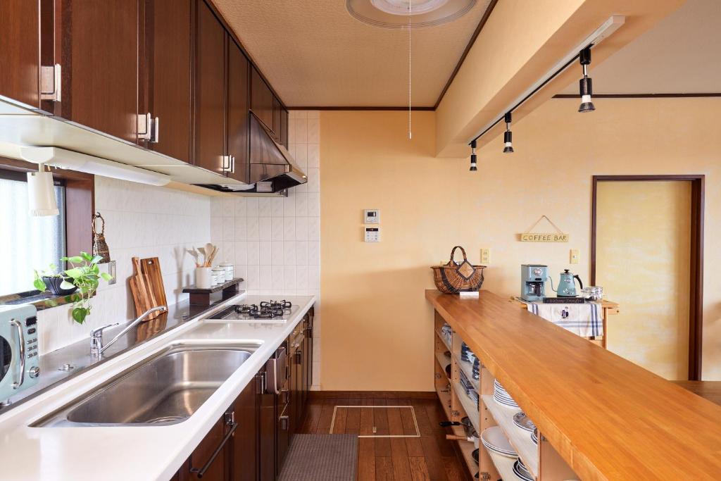 Kuchyň nebo kuchyňský kout v ubytování 一棟貸し別荘 mitt house inn