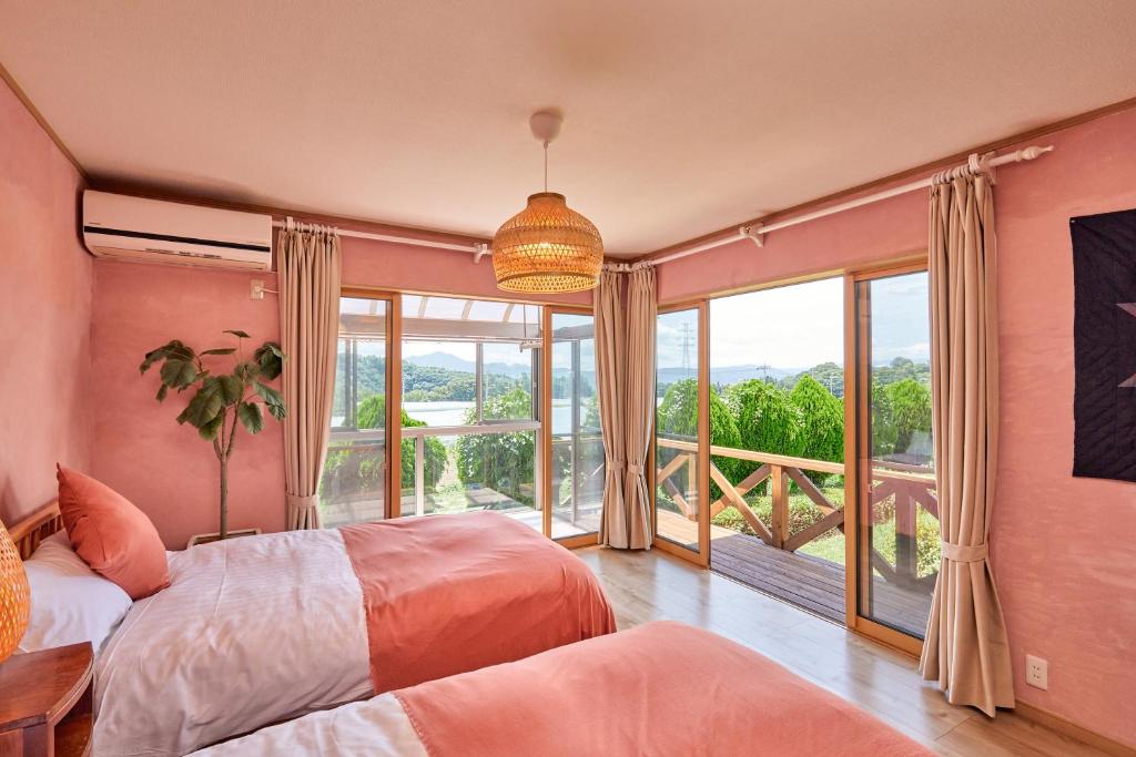 Postel nebo postele na pokoji v ubytování 一棟貸し別荘 mitt house inn