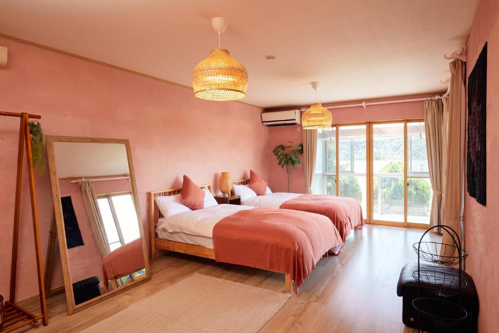 Postel nebo postele na pokoji v ubytování 一棟貸し別荘 mitt house inn