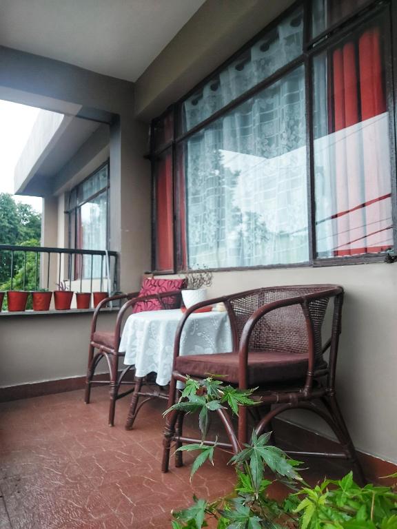 Balkón nebo terasa v ubytování Indivar Homestay