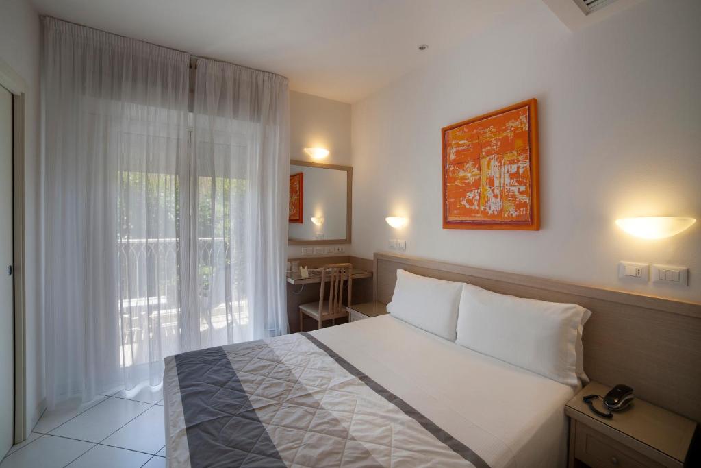 Postel nebo postele na pokoji v ubytování Hotel Gala