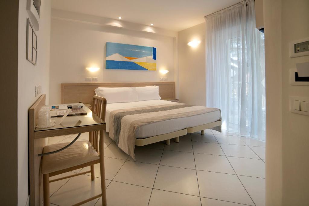 Postel nebo postele na pokoji v ubytování Hotel Gala