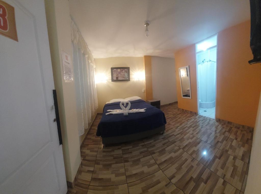 En eller flere senge i et værelse på ElOlympo