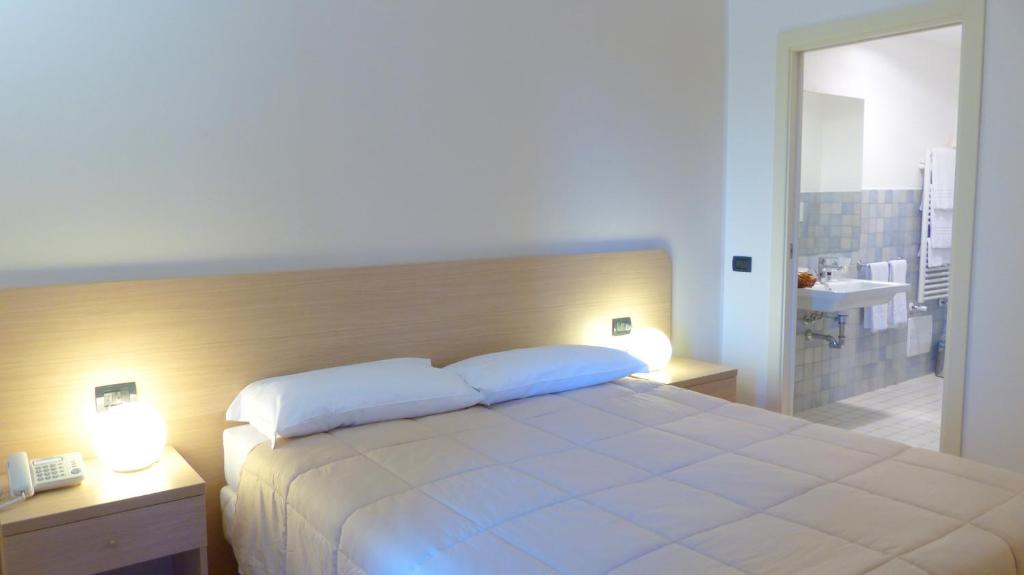 Postel nebo postele na pokoji v ubytování Mercury Boutique Hotel