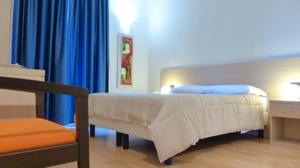 Postel nebo postele na pokoji v ubytování Mercury Boutique Hotel
