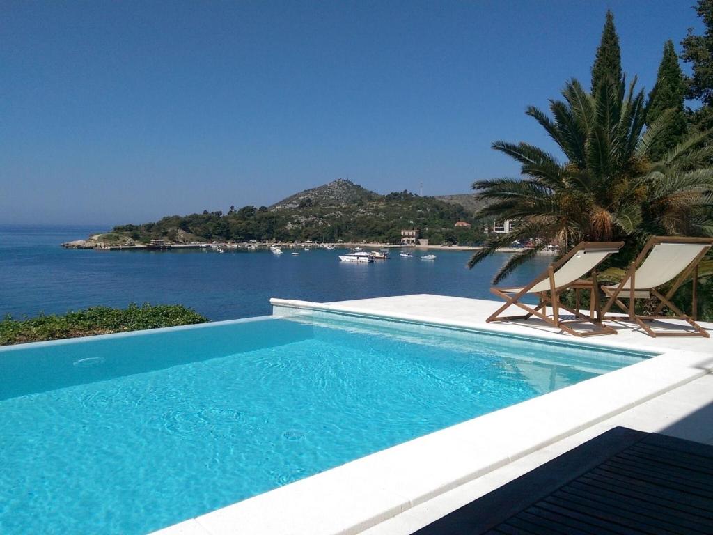 Villa Mirjana - One Bedroom Apartment with Terrace and Side Sea View Taverna