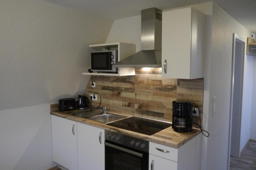 Kuchyň nebo kuchyňský kout v ubytování Hotel Haus Wittwer